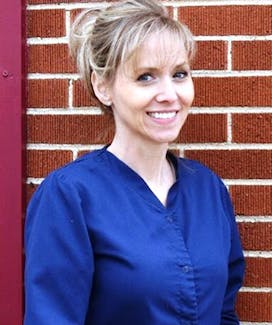 Photo of a woman with a beautiful smile in a uniform